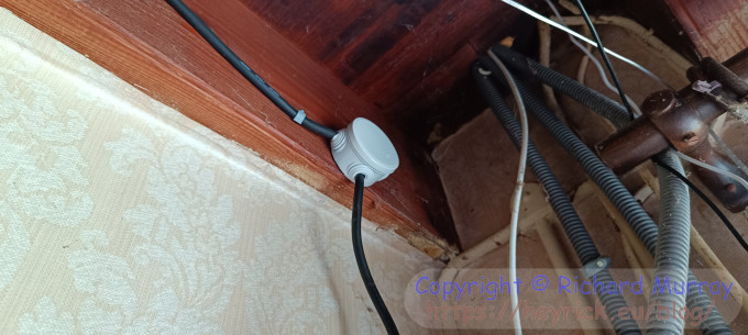 A photo of a plastic junction box to join two lengths of electric cable