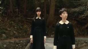 Screen capture from Fatal Frame showing two girls in school uniform on a bridge, and even in daylight it manages to be spooky.