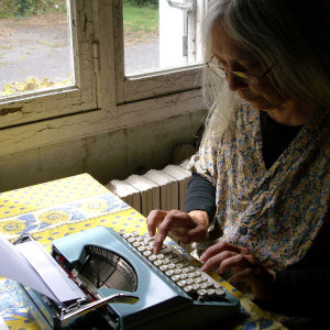 Mom using a typewriter.